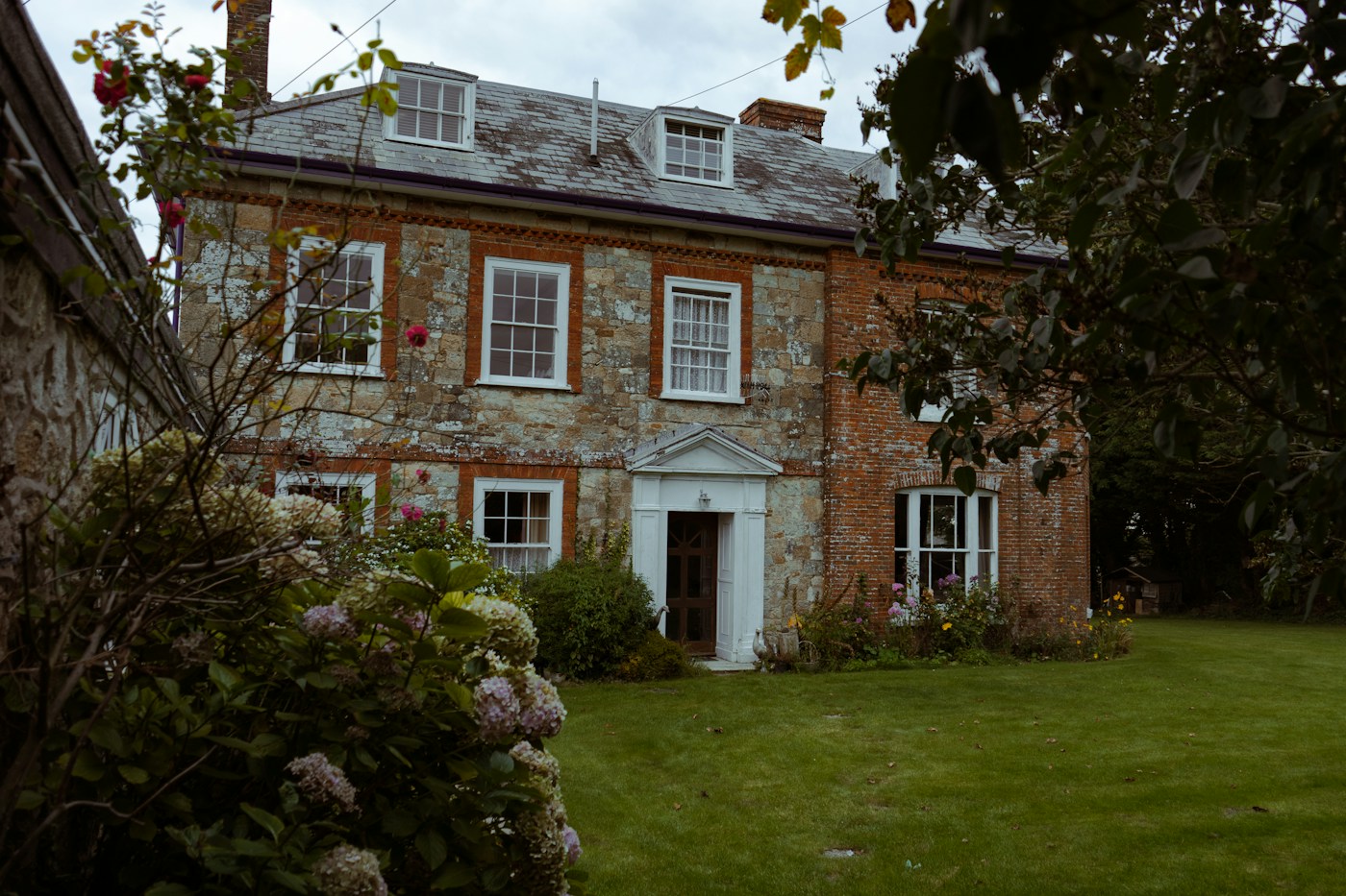 Traditional white windows on a brick home